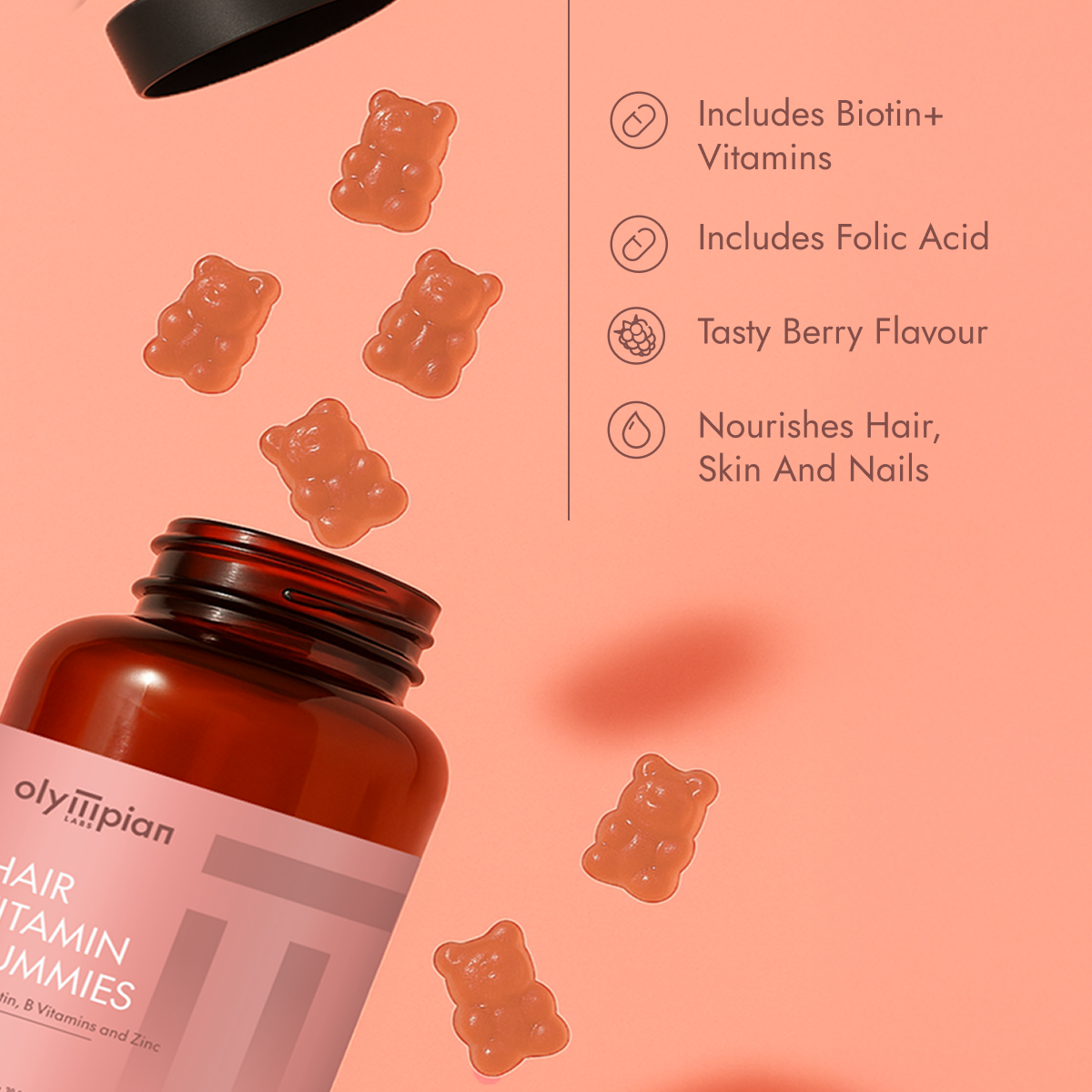 Hair vitamin gummies with a bottle on a pink background