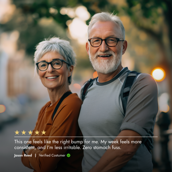 Two elderly people standing together with a blurred background