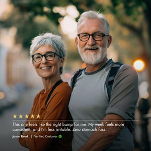 Two elderly people standing together with a blurred background