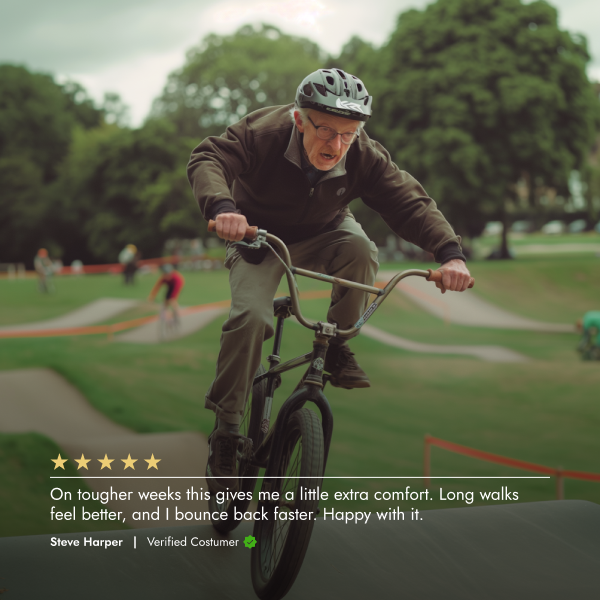Man riding a bike in a park with a blurred background